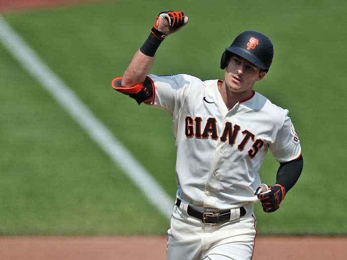 Mike Yastrzemski rounds third base